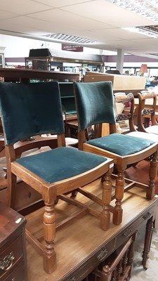 Lot 1083 - Pair of oak dining chairs with blue padded seats and backs