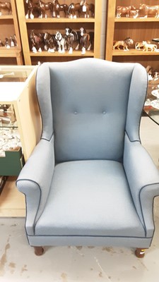 Lot 1113 - Georgian style wing back armchair with blue upholstery on turned front legs