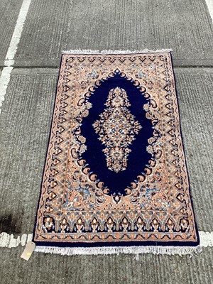 Lot 1125 - Eastern rug with geometric decoration on cream and blue ground, 201cm x 118cm