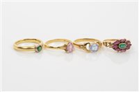 Lot 620 - Group of four gold and gem set dress rings -...