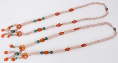 Lot 198 - Two Chinese carved pink hard stone bead necklaces