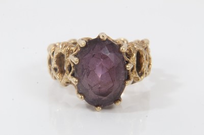Lot 96 - 9ct gold amethyst cocktail ring in claw setting on pierced abstract design shank