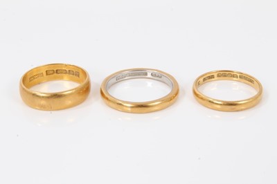 Lot 204 - Three 22ct gold wedding rings, one with platinum interior
