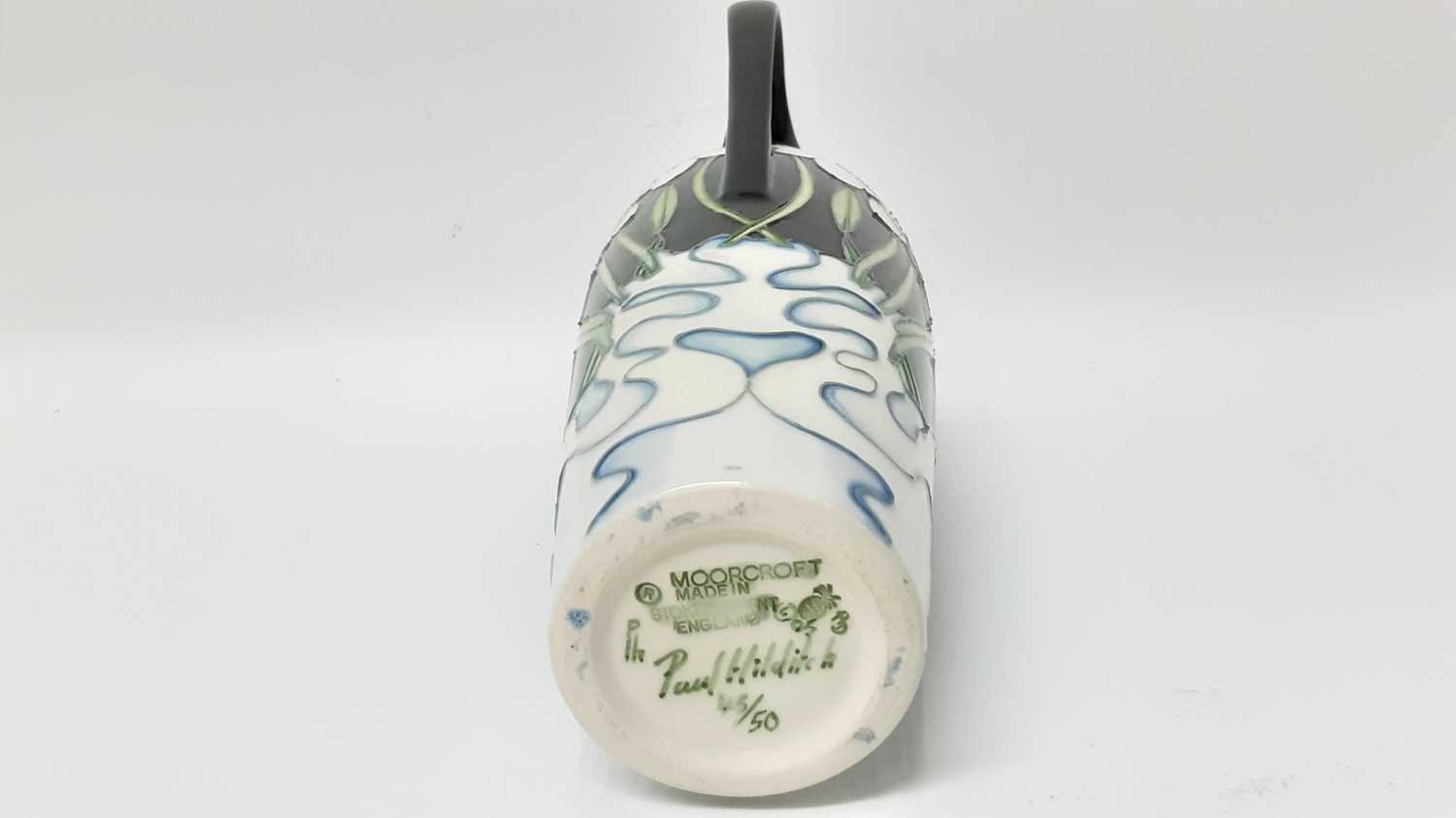 Lot 1209 - Moorcroft limited edition pottery vase decorated with white flowers on black ground, number 45 of 50, signed Paul Hilditch, 27.5cm high