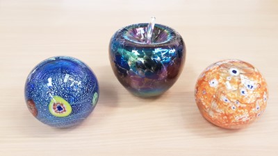 Lot 1328 - Three large paperweights, comprising two Murano and one Heron Apple (3)
