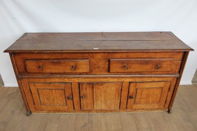 Lot 1043 - Early 18th century elm dresser base with two drawers and cupboards 
below