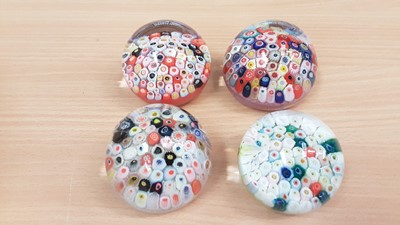 Lot 1332 - Four Strathearn end of day carpet paperweights circa. 1970's (4)