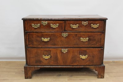 Lot 1302 - Early 18th century walnut veneered chest of two short and two long drawers