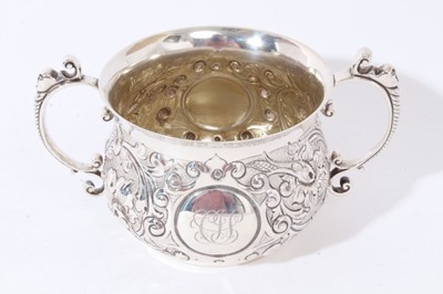 Lot 225 - Victorian silver two-handled porringer with embossed decoration