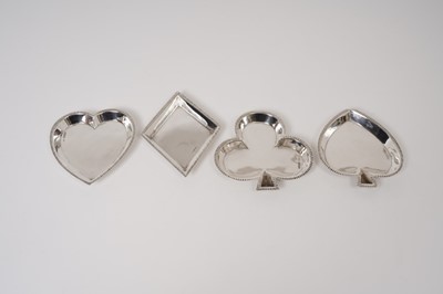 Lot 224 - Set of four Edwardian silver ‘card game’ ashtrays