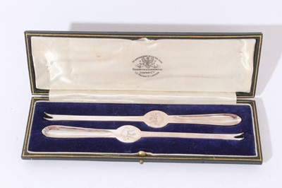 Lot 204 - Pair of lobster picks, crested, by Goldsmiths and Silversmiths, Sheffield 1928, cased