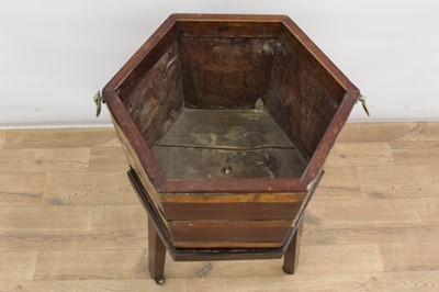 Lot 1328 - George III mahogany and brass bound hexagonal cellarette on stand (lacking lid)