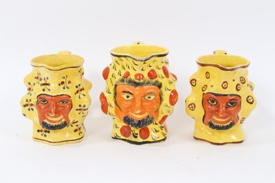Lot 11 - Set of three early 19th century Staffordshire canary yellow Satyr-mask jugs