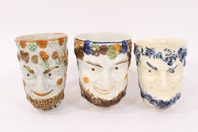 Lot 12 - Group of nine 18th and early 19th century Staffordshire Satyr-mask jugs, including Whieldon and Pratt type examples, 9cm to 12.5cm high