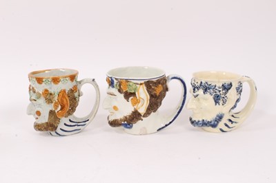 Lot 12 - Group of nine 18th and early 19th century Staffordshire Satyr-mask jugs, including Whieldon and Pratt type examples, 9cm to 12.5cm high