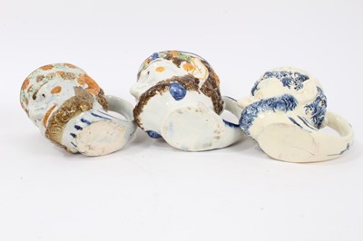 Lot 12 - Group of nine 18th and early 19th century Staffordshire Satyr-mask jugs, including Whieldon and Pratt type examples, 9cm to 12.5cm high