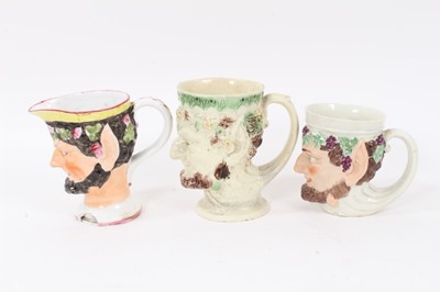 Lot 12 - Group of nine 18th and early 19th century Staffordshire Satyr-mask jugs, including Whieldon and Pratt type examples, 9cm to 12.5cm high