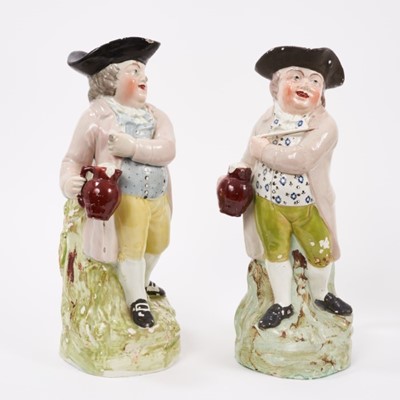 Lot 15 - Two Pearlware-glazed 'Hearty Good Fellow' Toby jugs