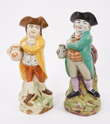 Lot 16 - Two Pearlware-glazed 'Hearty Good Fellow' Toby jugs