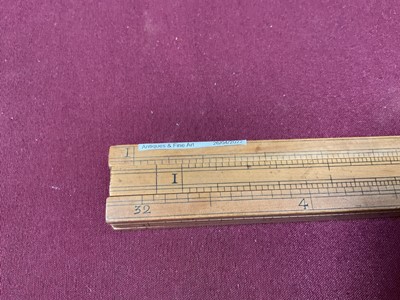 Lot 828 - Rare 18th century boxwood rule with three slides, each with measurements, the removeable rules with Ale, Wine, Malt etc, measurements for use by Customs & Excise in the brewery trade. Stamped 'E. R...