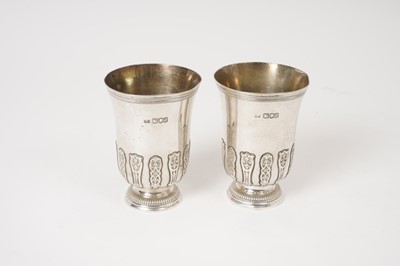 Lot 366 - Pair of Carrington & Co silver cups/beakers with applied cut and pierced card strapwork decoration London 1916