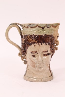 Lot 18 - Prattware loving cup, circa 1790, modelled to two sides with masks of the Royal couple George III and Queen Charlotte, impressed 'GOD SAVE THE KING AND GOD SAVE THE QUEEN' around the rim, washed in...