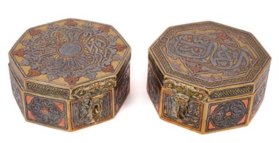 Lot 136 - Two similar Mamluk revival inlaid metalware boxes, each of octagonal form with locking clasp and Islamic script ornament, 9.5cm wide