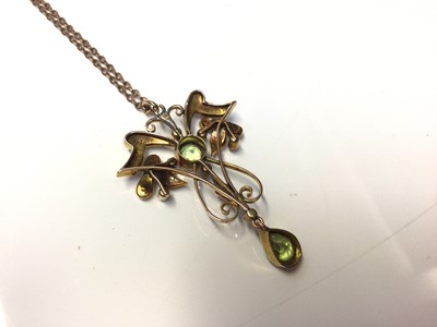 Lot 43 - Edwardian 15ct gold peridot and seed pearl open work pendant on chain