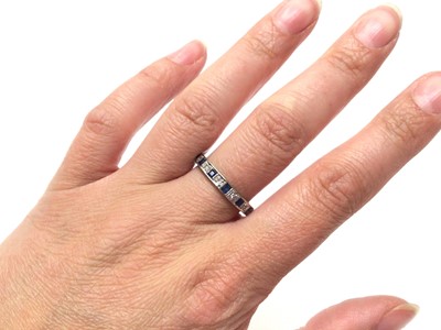 Lot 46 - Diamond and synthetic sapphire eternity ring in white gold setting