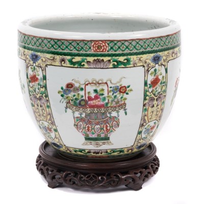Lot 93 - A Chinese famille verte jardinière and carved wood stand