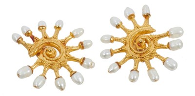 Lot 520 - Pair of gold and freshwater cultured pearl earrings the stylized scroll with beaded decoration and clip fittings, marked '916'.