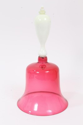 Lot 120 - A Victorian cranberry tinted glass bell