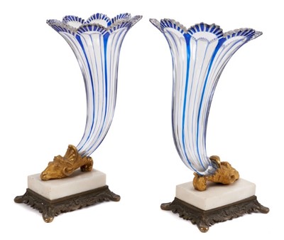 Lot 188 - A pair of mid 19th century Bohemian blue flash glass cornucopia, on parcel gilt bronze and marble bases