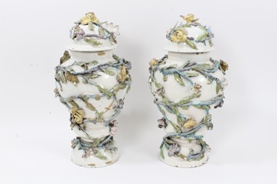 Lot 143 - A rare pair of Italian faience vases and covers, circa 1760