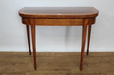 Lot 1442 - George III mahogany and satinwood crossbanded D-shaped card table, with baize lined interior, raised on square tapered legs and spade feet, 93cm wide x 46cm deep x 74cm high