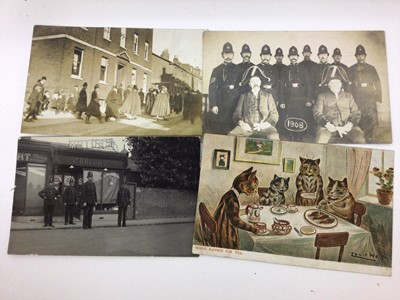 Lot 1426 - Postcards in large album including real photographic animated street scenes and shop fronts