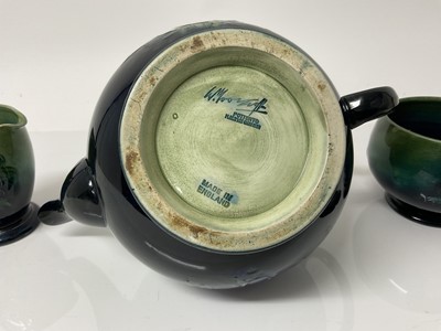Lot 1098 - Moorcroft pottery poppy pattern teapot with sugar bowl and milk jug