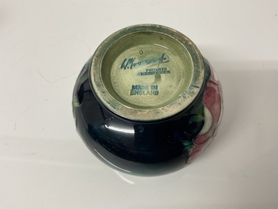 Lot 1098 - Moorcroft pottery poppy pattern teapot with sugar bowl and milk jug