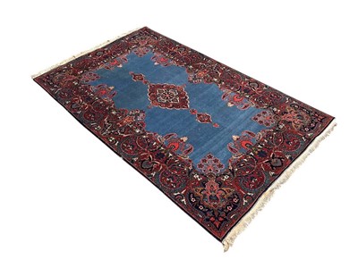 Lot 1290 - Fine Kashan rug with sapphire blue ground