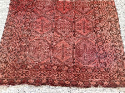 Lot 1433 - Afghan Belouche rug with three rows of five quartered medallions