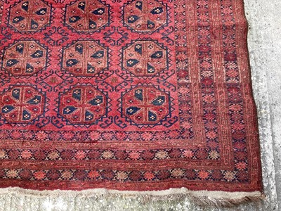 Lot 1441 - Afghan Belouche rug with three rows of seven quartered medallions