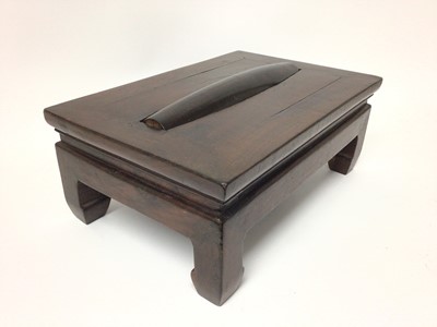 Lot 1412 - Chinese hardwood foot rest massage footstool 'Gundeng', with rectangular top set with a cylindrical roller, raised on four stout legs, 42cm wide