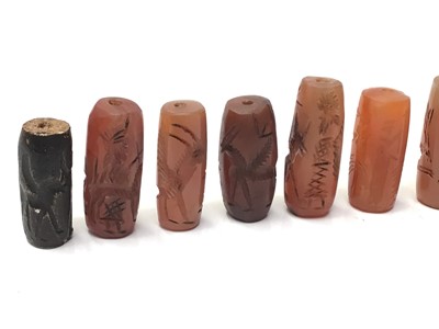 Lot 42 - Collection of Chinese carved carnelian tubular beads and others