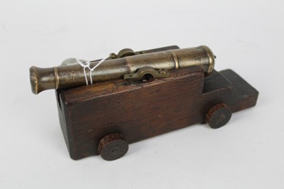 Lot 921 - Small 19th century Bronze signalling cannon on later oak gun carriage