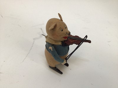 Lot 1894 - Schuco clockwork model of a pig playing the violin, together with a German clockwork rabbit (2)