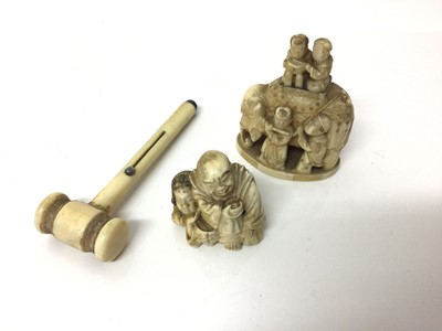 Lot 20 - Japanese carved ivory netsuke, together with an okimono and a carved ivory combination gavel and pencil