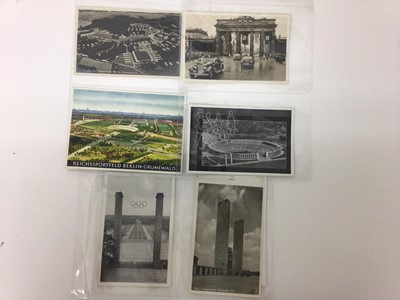 Lot 1413 - 1936 Berlin Olympics real photographic and artist drawn postcards in album and book.
