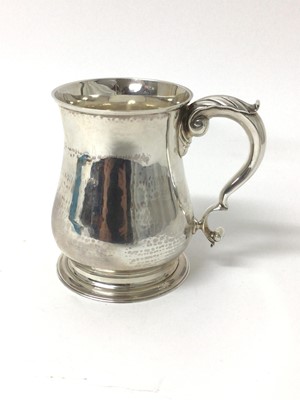 Lot 72 - George II style silver pint tankard of baluster form, London 1938.