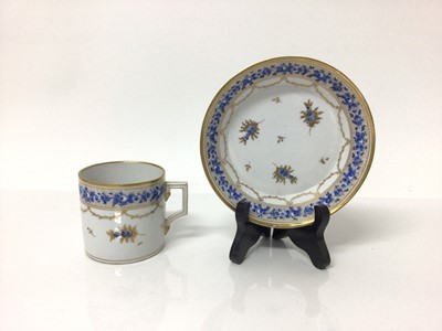 Lot 9 - Continental Nyon porcelain cup and saucer, late 18th/early 19th century, with blue enamelled and gilt floral patterns and swags, underglaze blue fish marks, the saucer measuring 13.5cm diameter