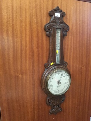 Lot 337 - Early 20th century carved oak aneroid barometer, thermometer by Maurice, Cohen & Co. Bradford